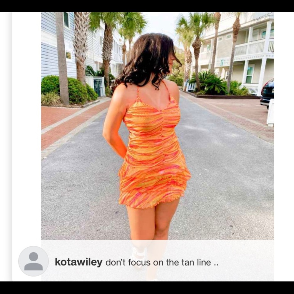 Short orange ruffle pattern dress